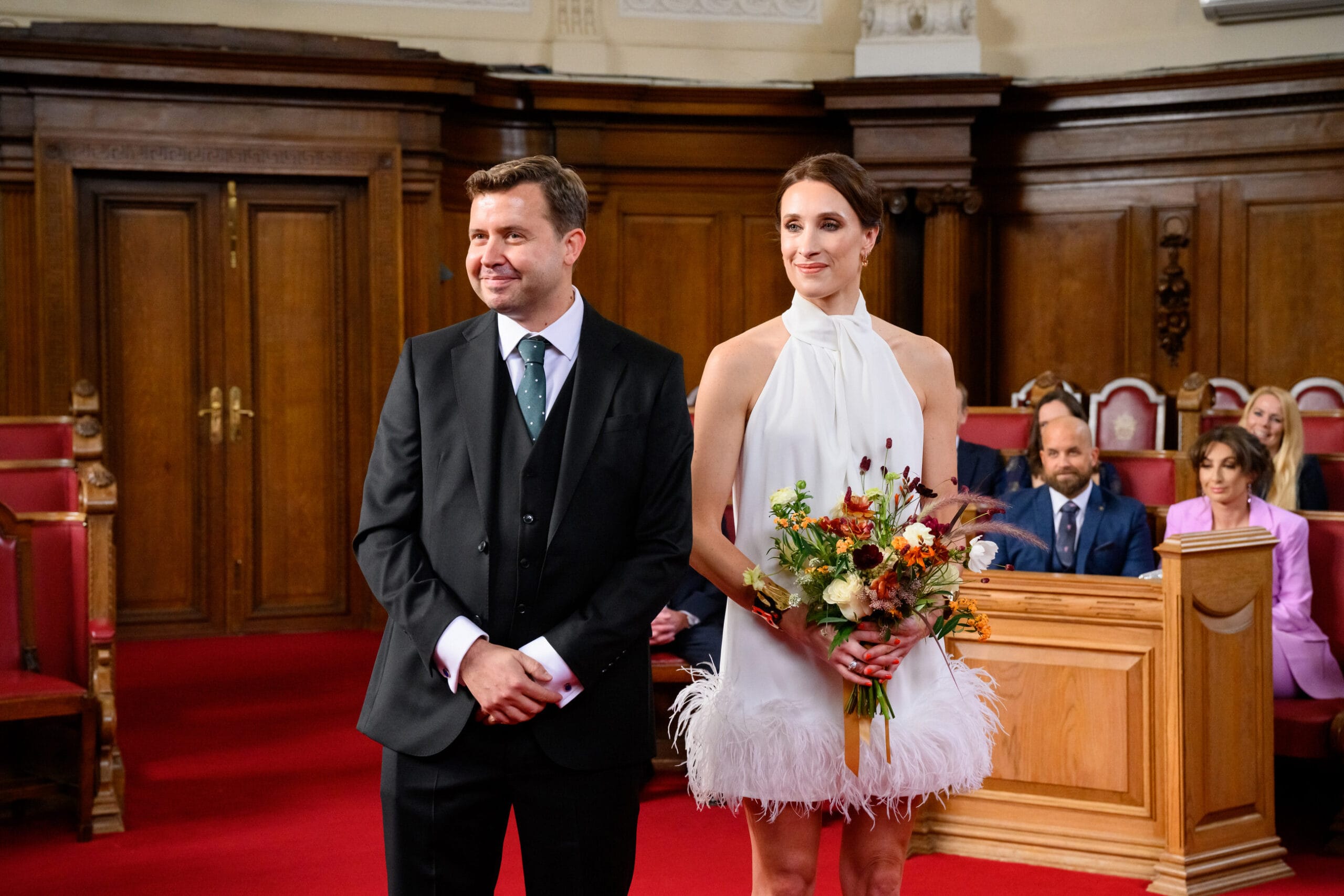 stylish bride and groom smiling during Islington Town Hall wedding ceremony