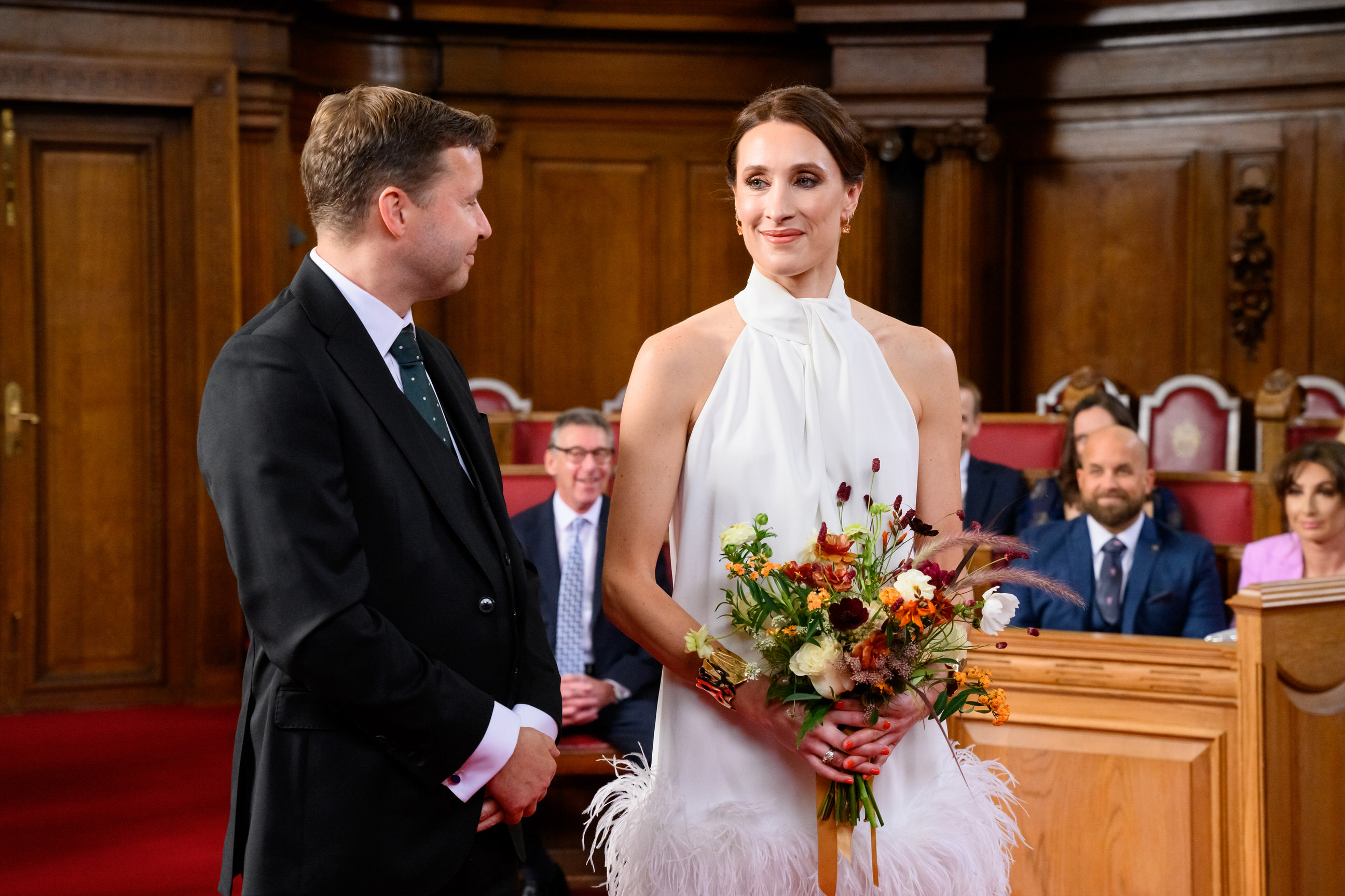 bride and groom stood in the council chamber during Islington Town Hall wedding