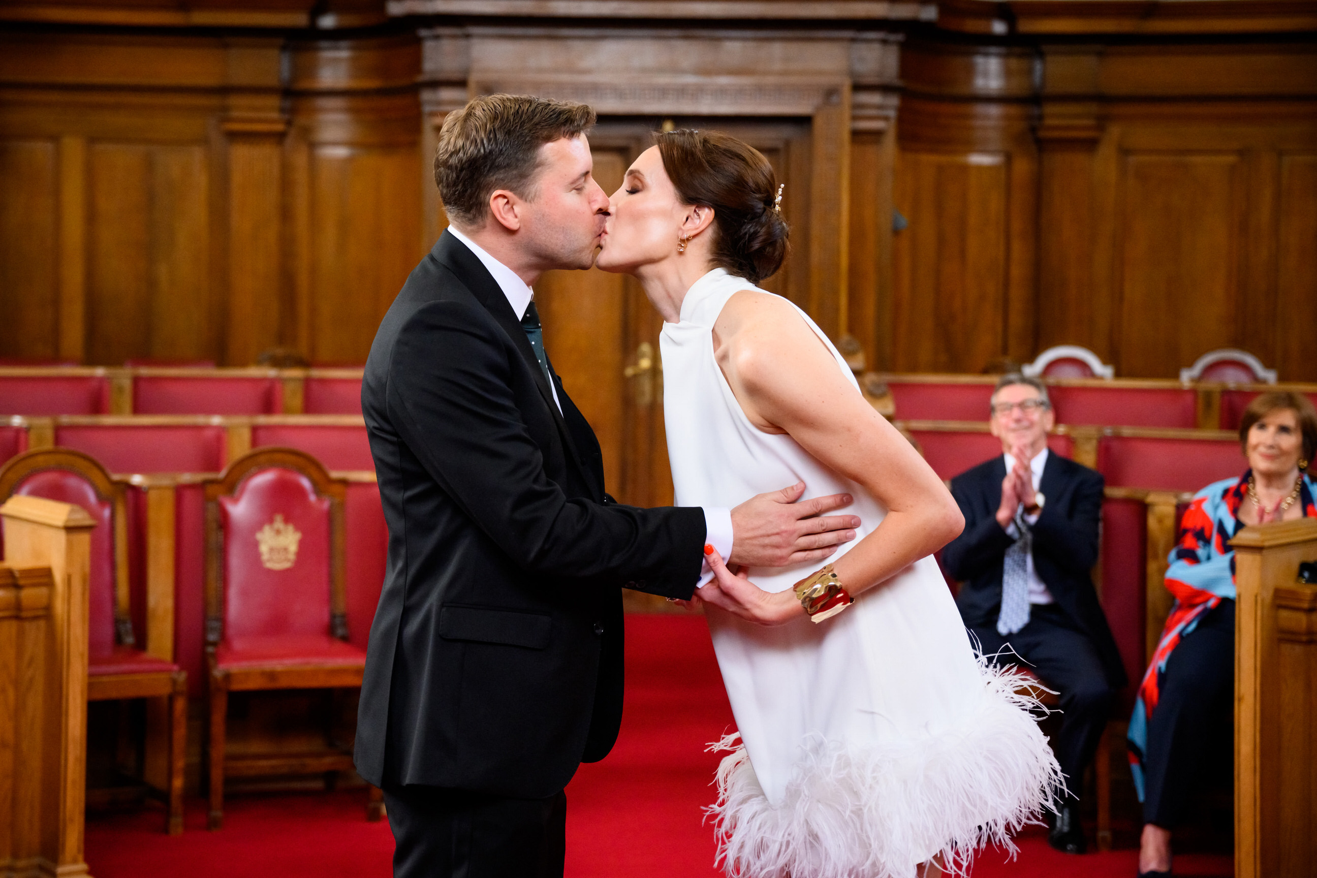bride and groom kissing during Islington Town Hall wedding ceremony