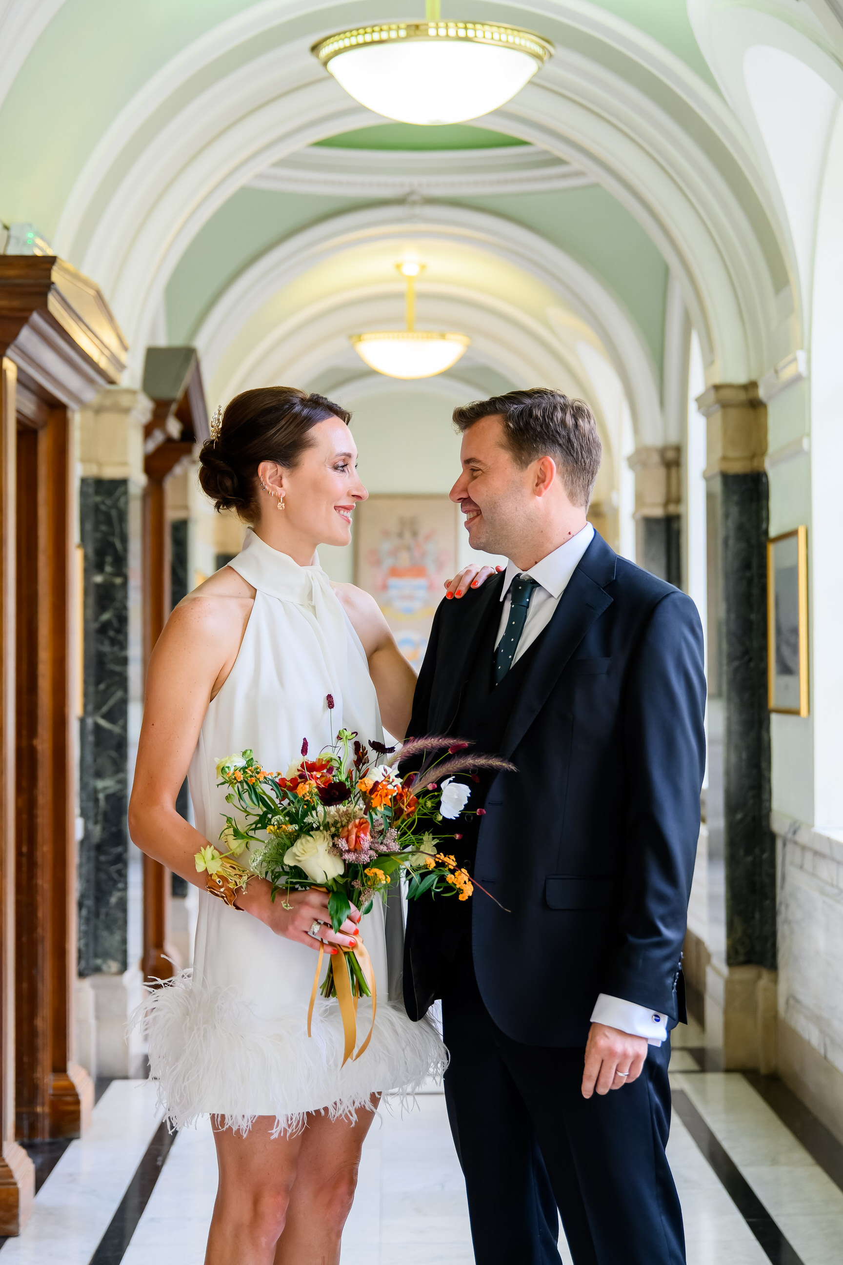 wedding couple smiling at each other during Islington Town Hall wedding photography