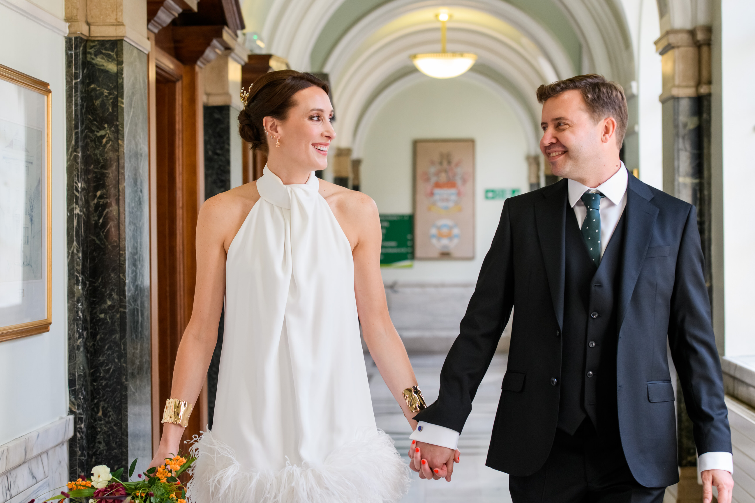 Bride and groom smiling during their wedding photography session at Islington Town Hall
