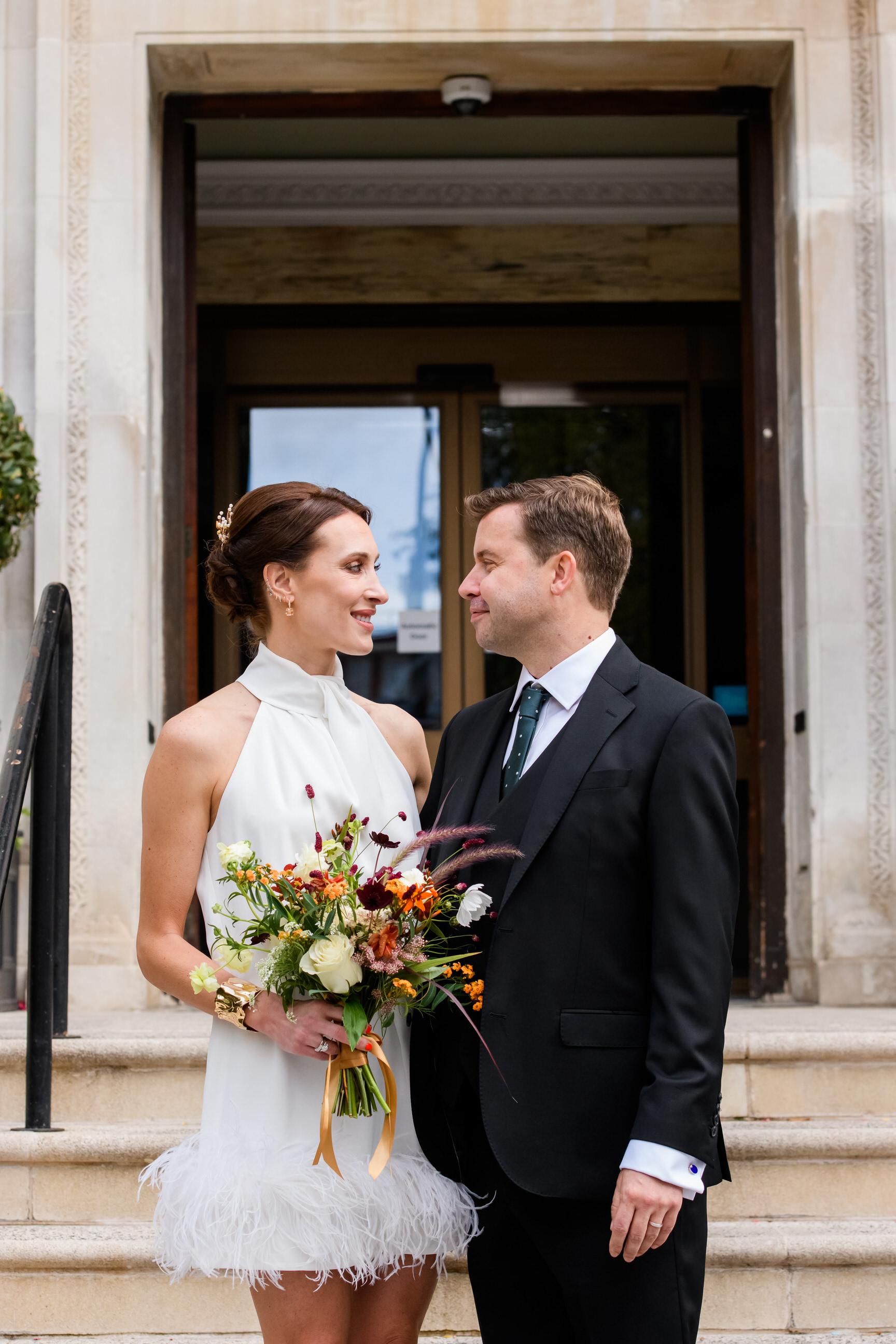 wedding couple smiling at each other during Islington Town Hall wedding photography