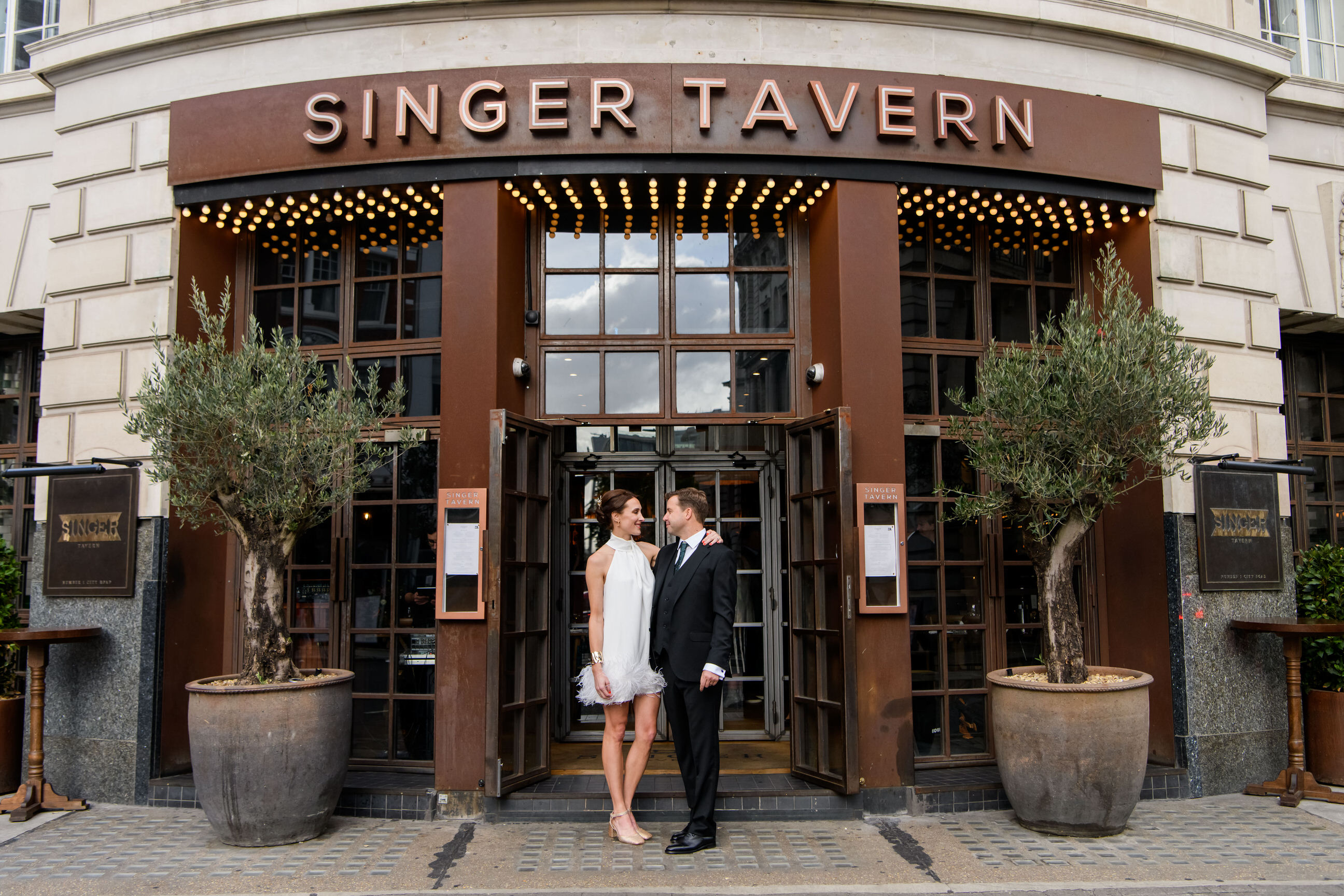 Bride and groom in front of The Singer Tavern wedding reception venue