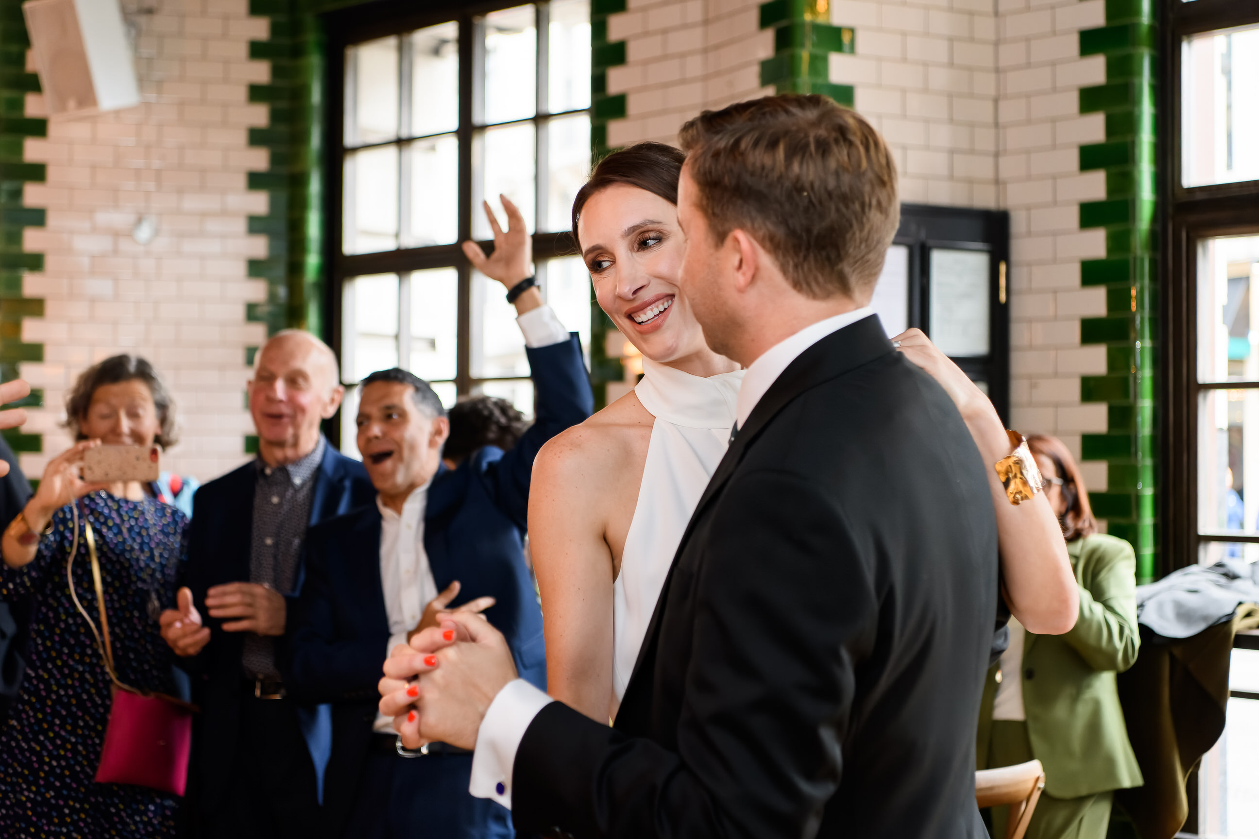 Bride and Groom dancing surrounded by guests at The Singer Tavern