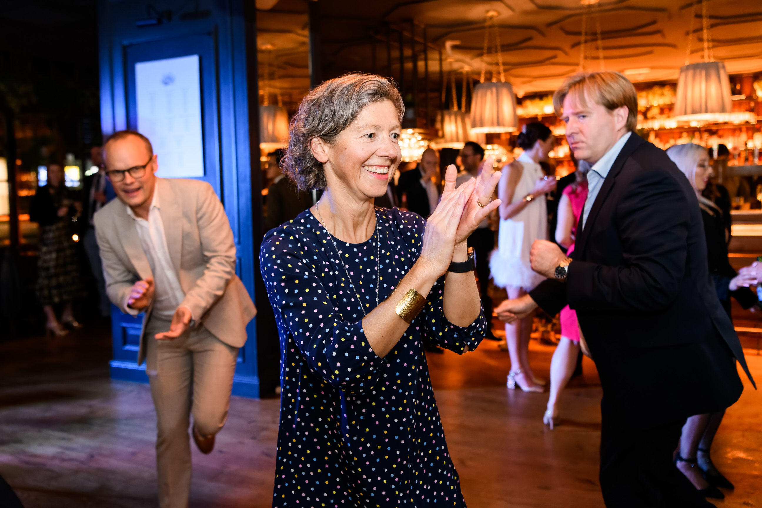 wedding guests dancing together during fun London pub wedding