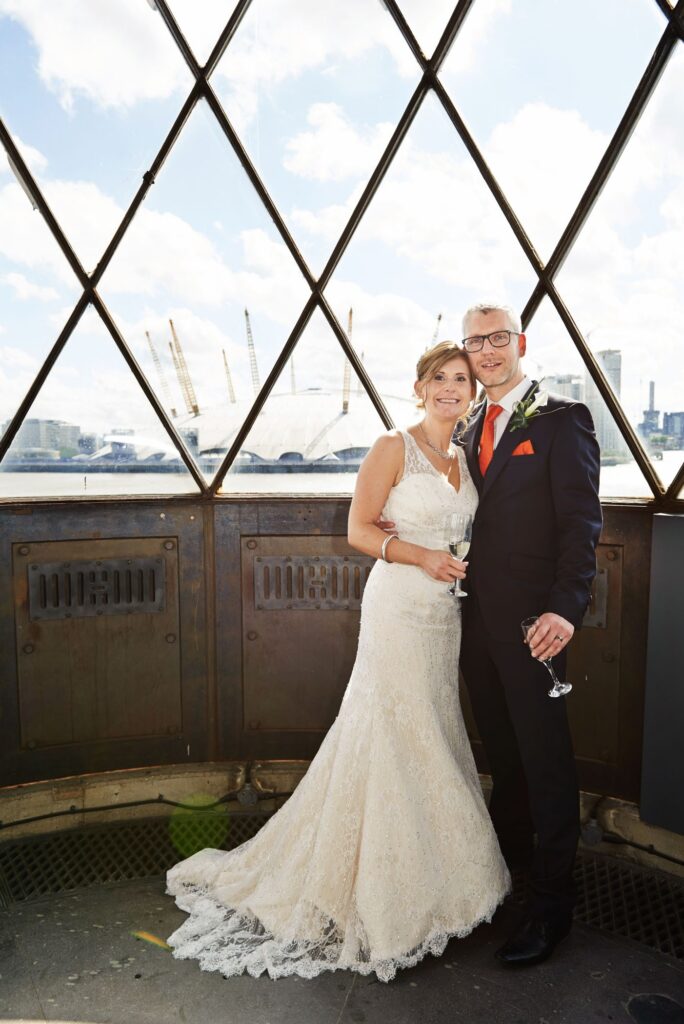 Wedding couple stood in the lighthouse at Trinity Bouy Wharf Chainstore Wedding Venue