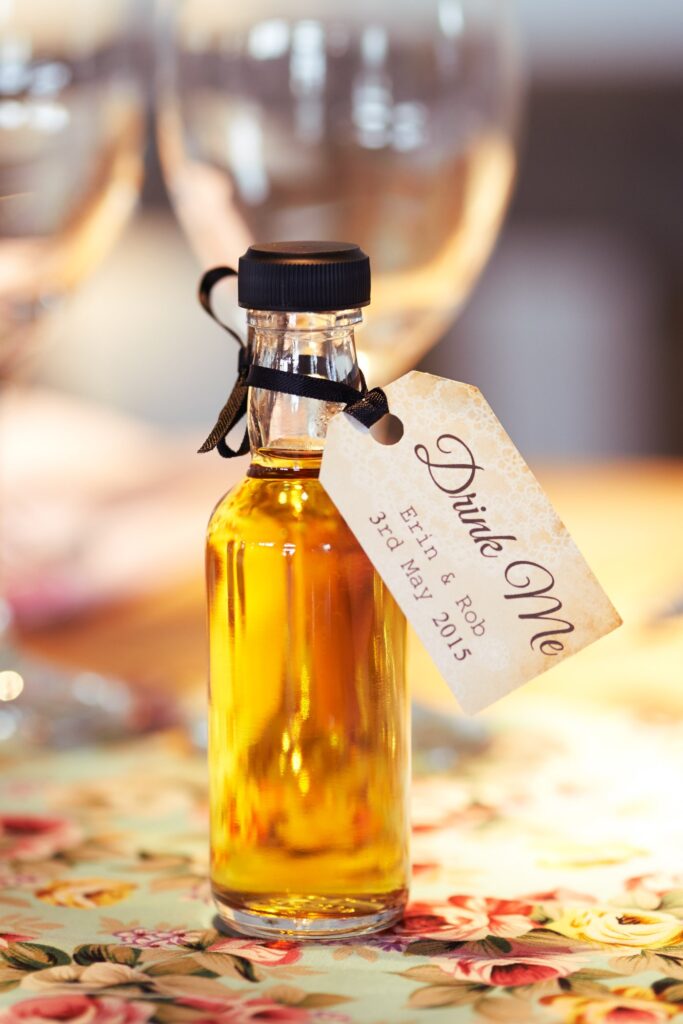 mini drink me alcohol wedding favour bottles at DIY wedding