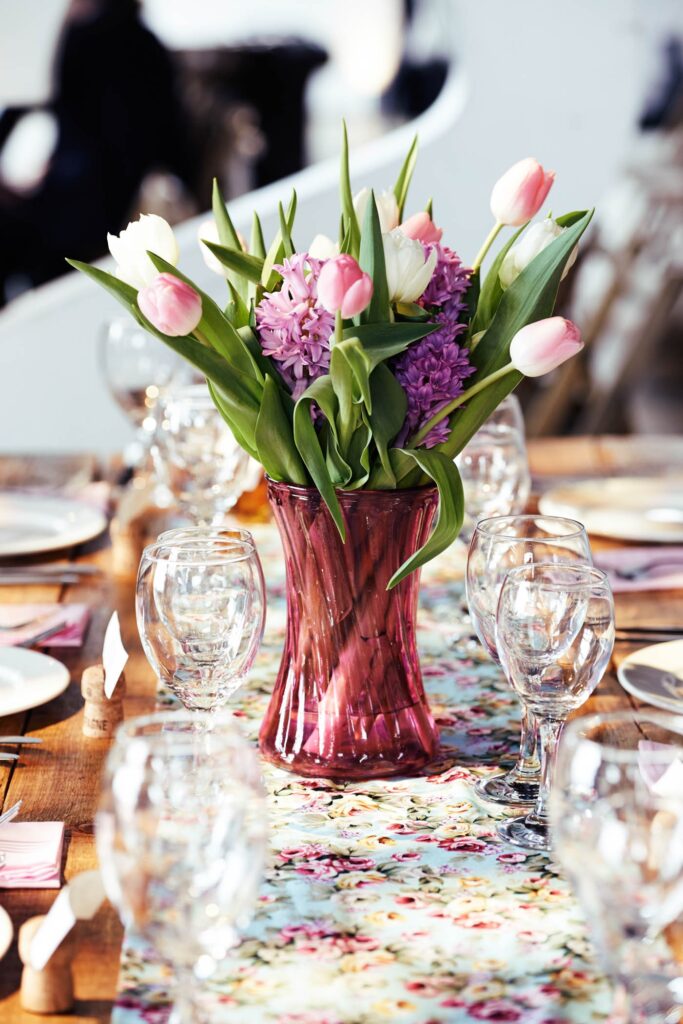 Flowers on DIY table at Trinity Bouy Wharf warehouse wedding