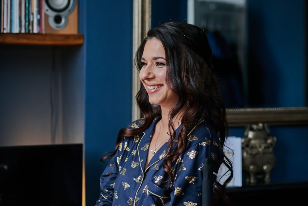 Bride smiling during bridal prep at her home