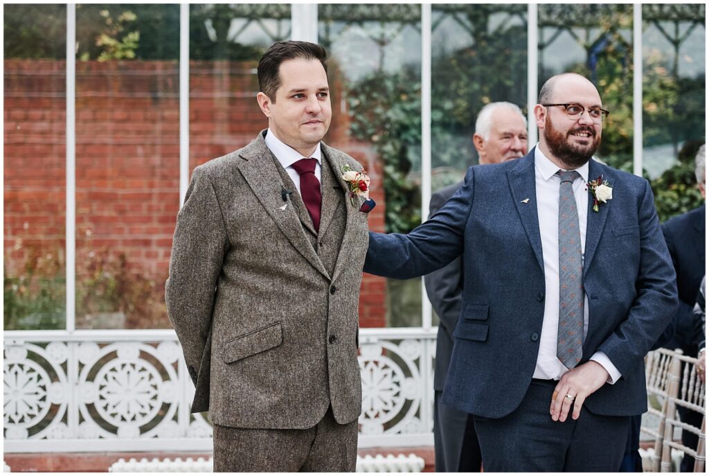 Groom stood waiting during conservatory wedding at The Horniman Museum