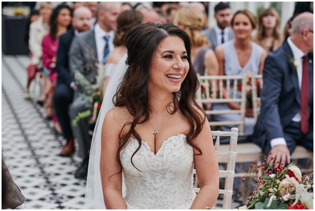 bride smiling during her wedding at The Horniman Museum conservatory