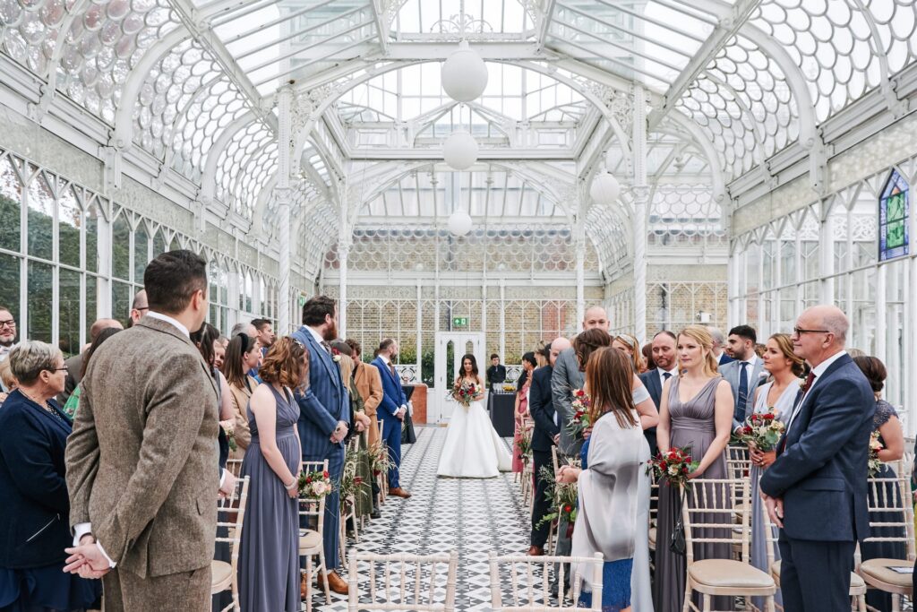 Bride walking down the aisle during winter wedding at The Horniman Museum