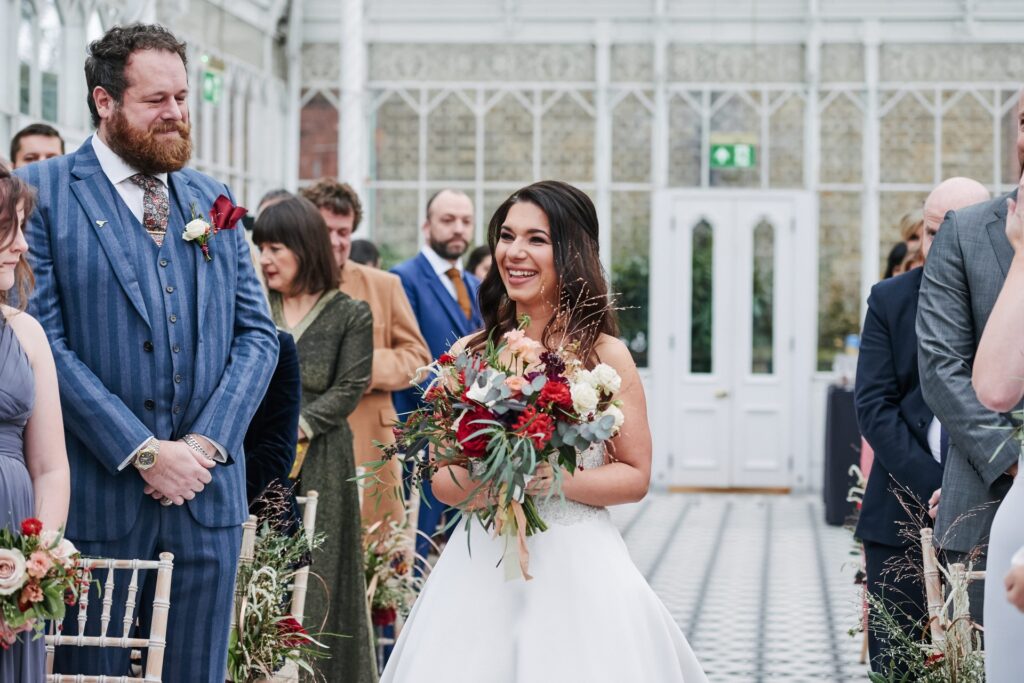 bride walking down aisle during conservatory wedding at The Horniman Museum