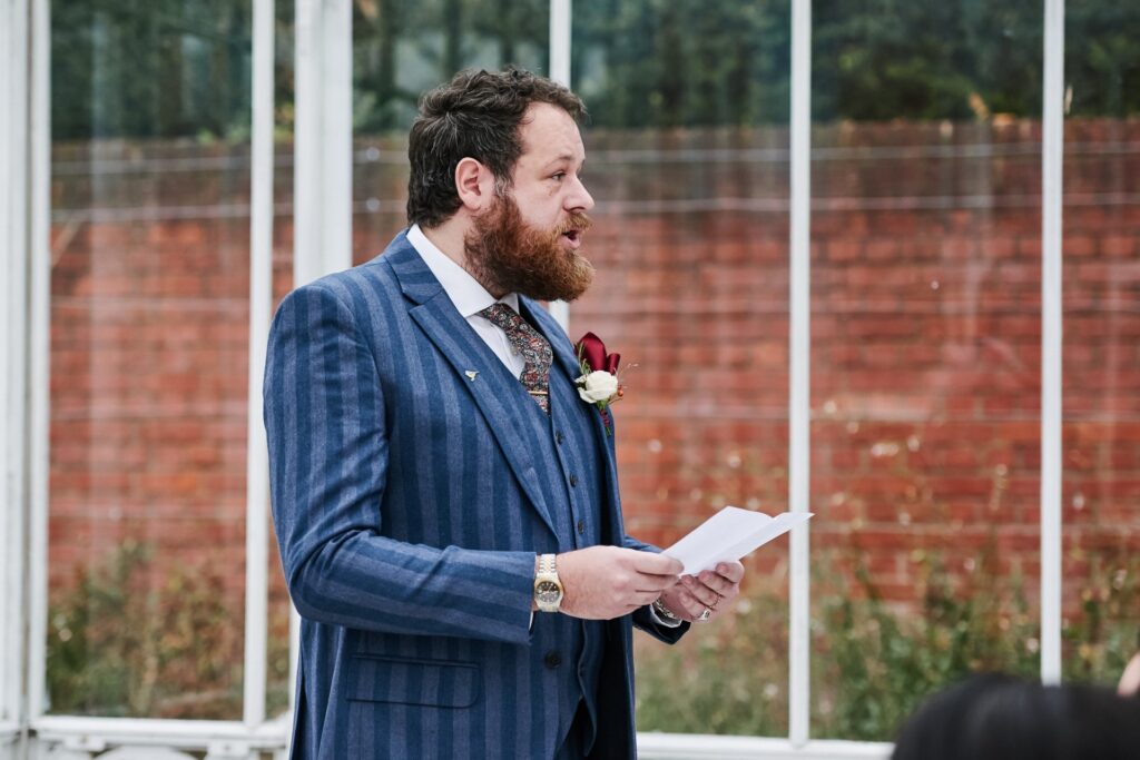 best man reading during ceremony at The Horniman Museum conservatory