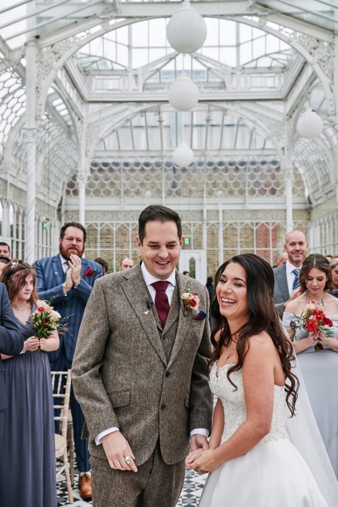 bride and groom laughing at The Horniman Museum conservatory