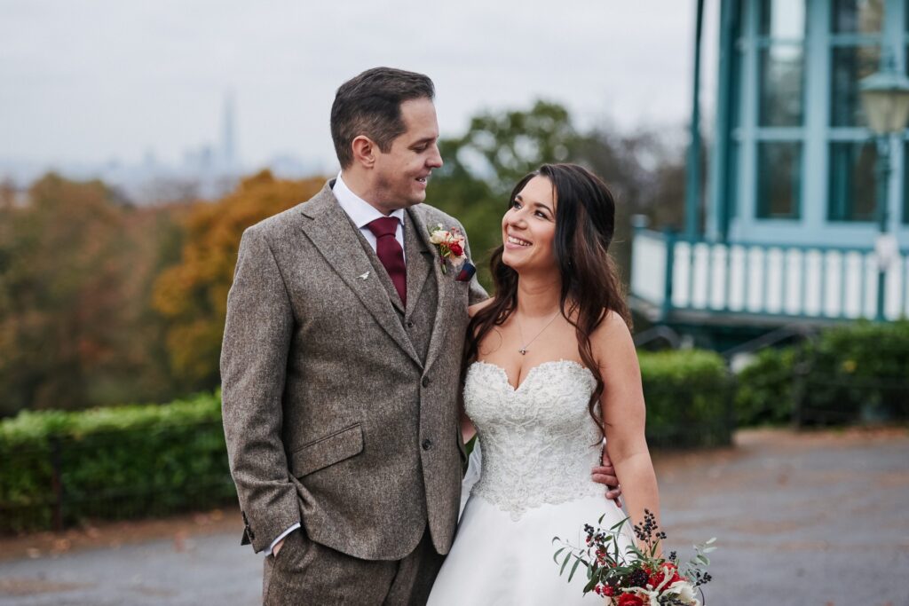 bride and groom in front of the bandstand at The Horniman museum. 