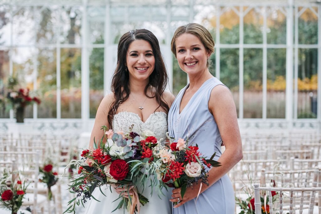 Bride with bridesmaid in the conservatory at The Horniman Museum