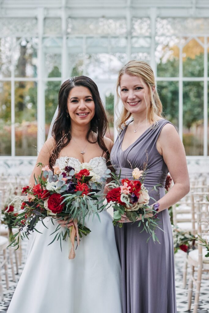 Bride with bridesmaid in the conservatory at The Horniman Museum