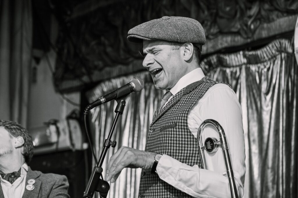1920's Jazz singer on the stage during winter wedding at Ivy House