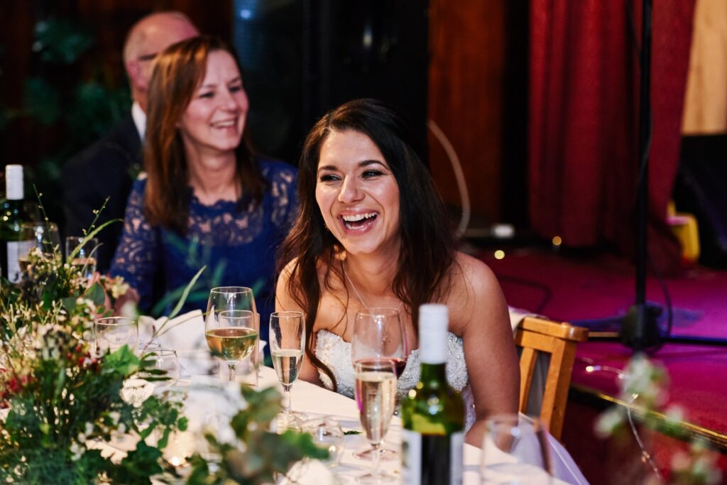 bride laughing during speeches at Ivy House pub wedding