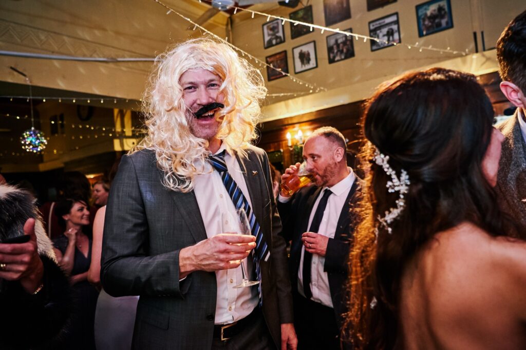 wedding guest in fancy dress during winter wedding at The Ivy House