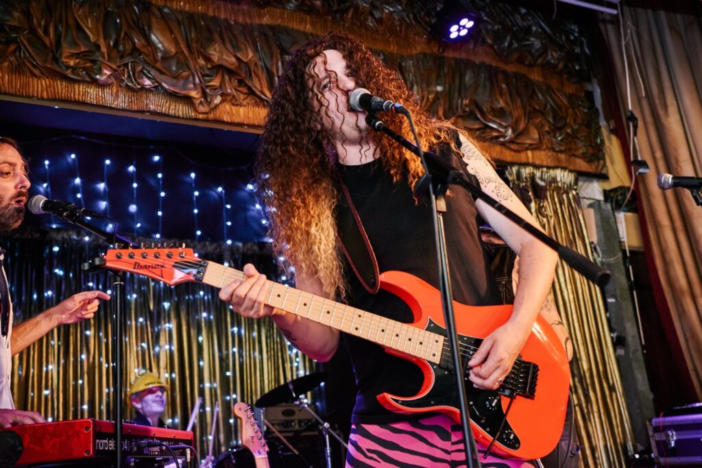 Groom dressed up as a glam rocker during his wedding at The Ivy House pub