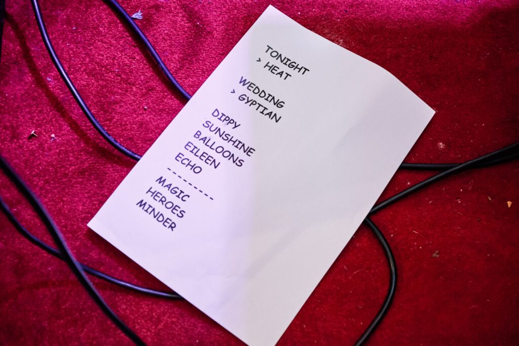 wedding band set list on red stage floor 